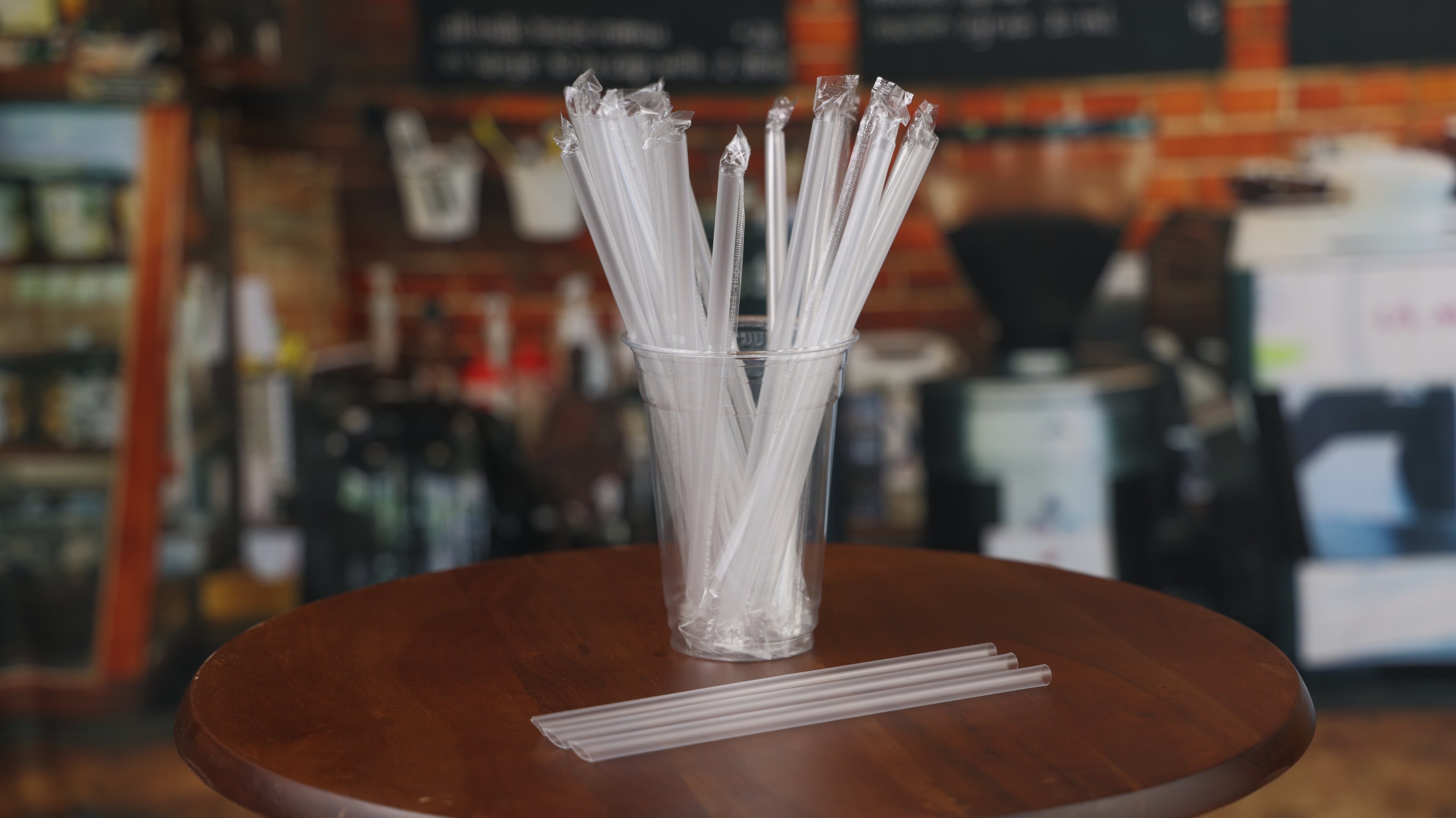 Clear wrapped straws in a cup